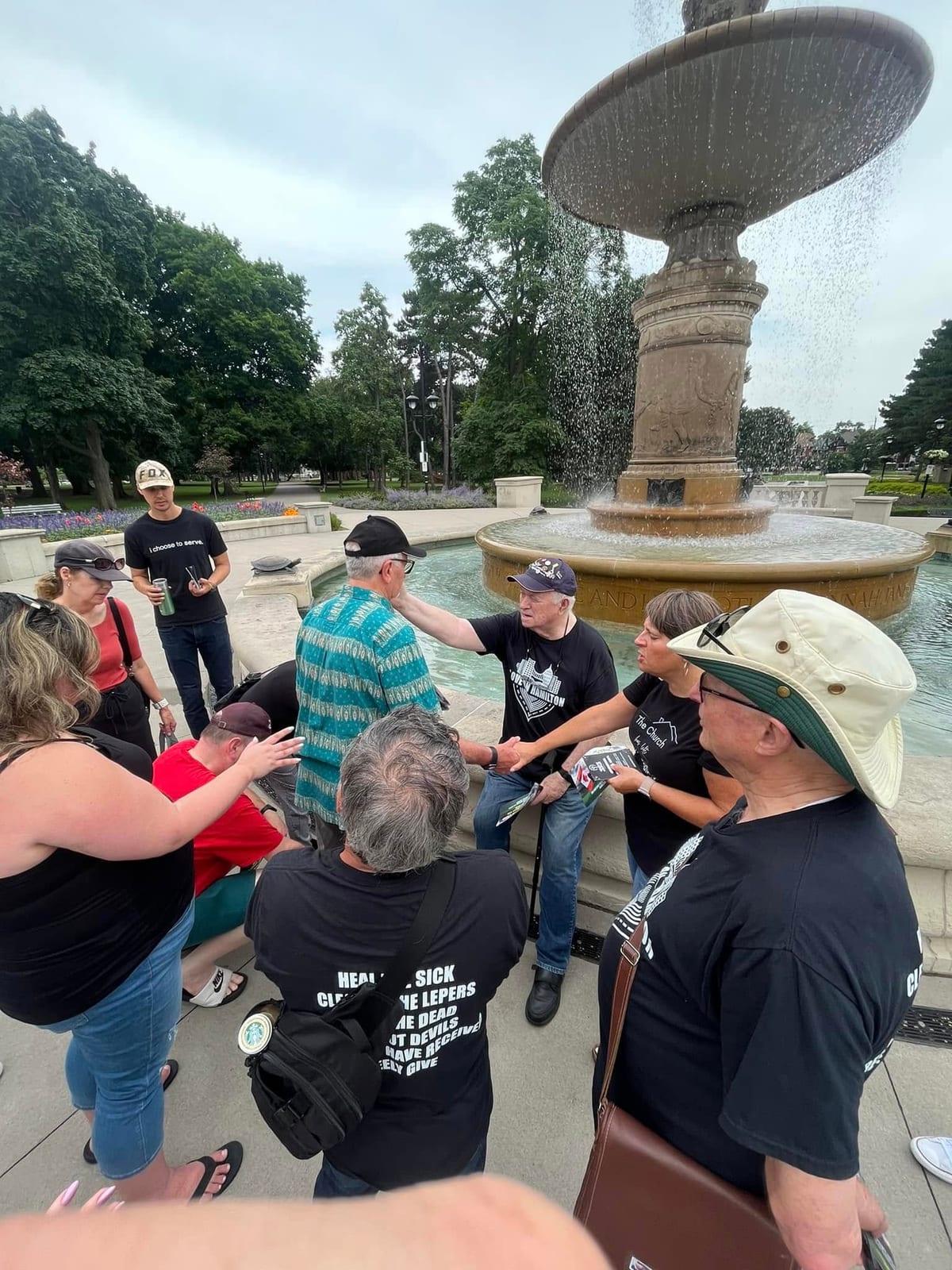 Praying for the city at the Gage Park fountain